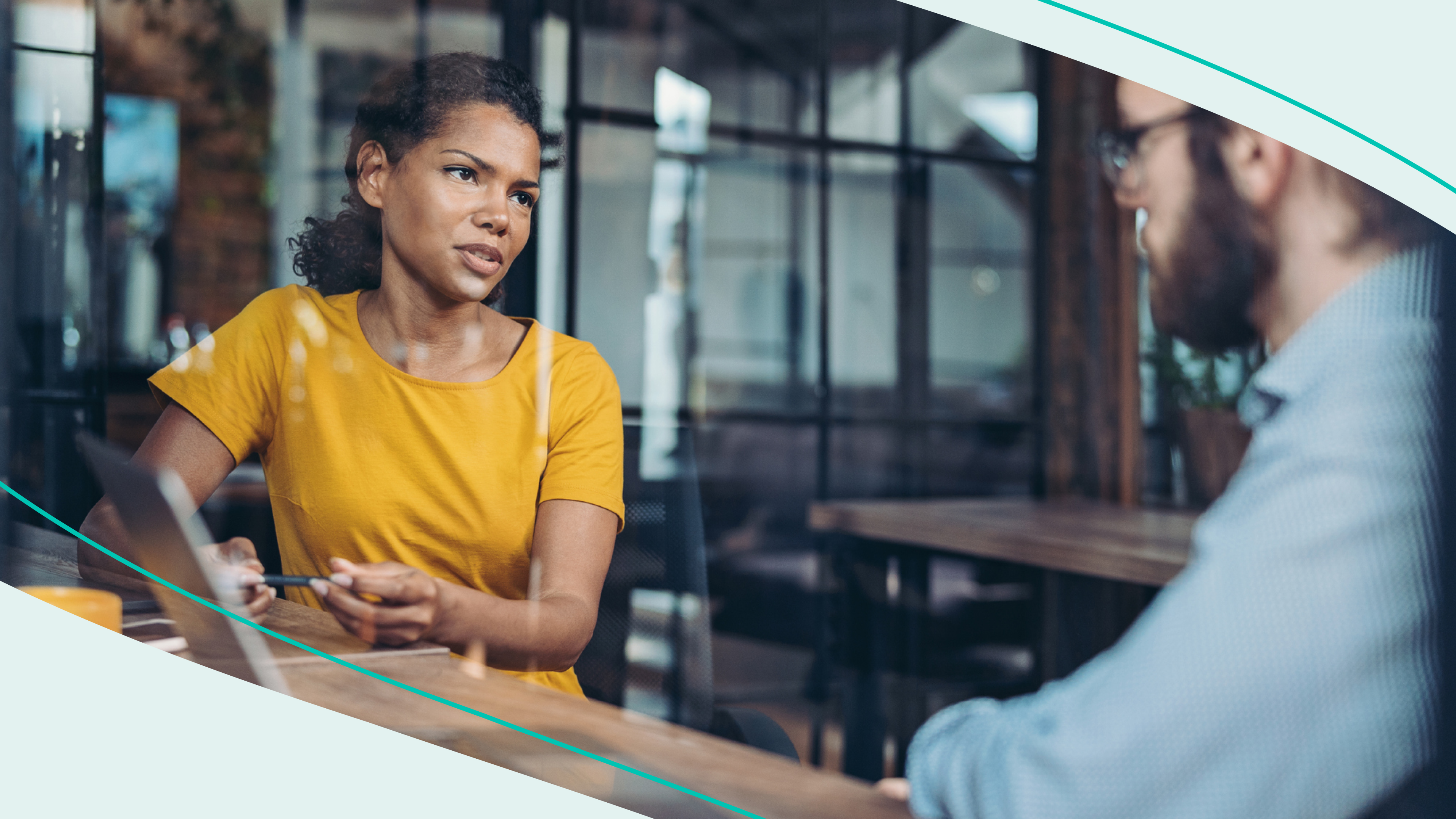 Woman talking to man in an office