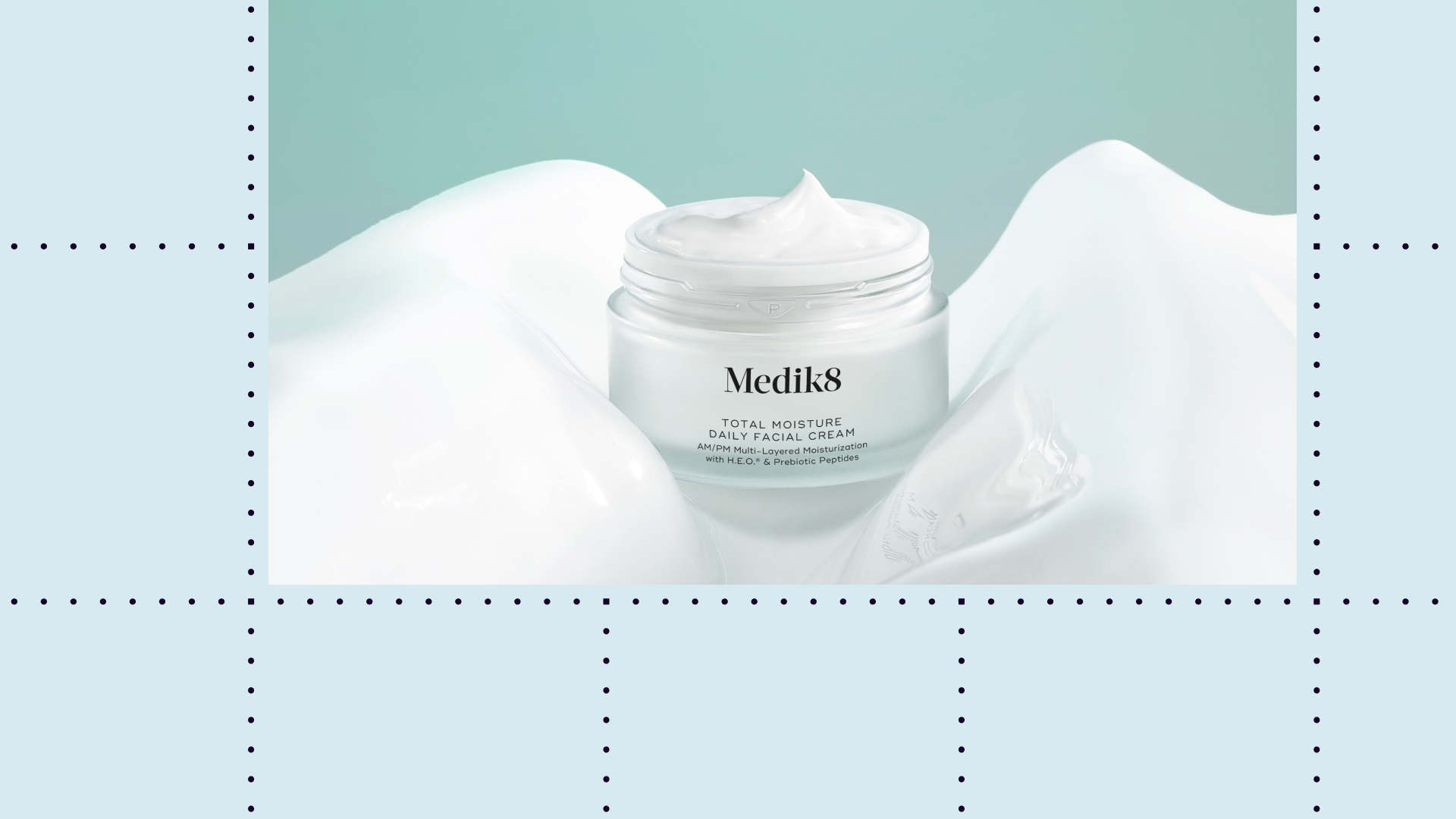 Open Medik8 moisturizer on a teal background