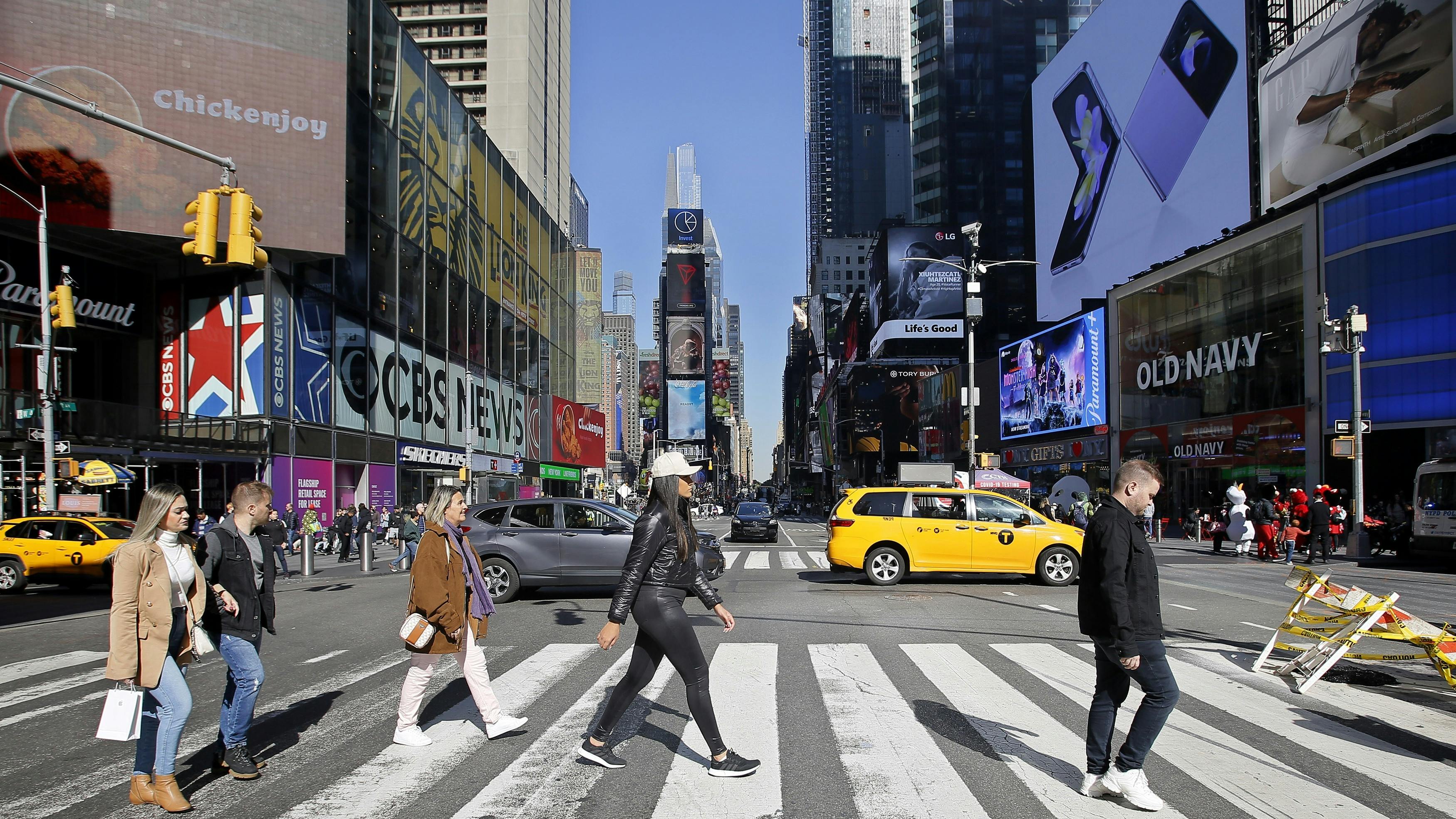 crosswalk filled with people in NYC