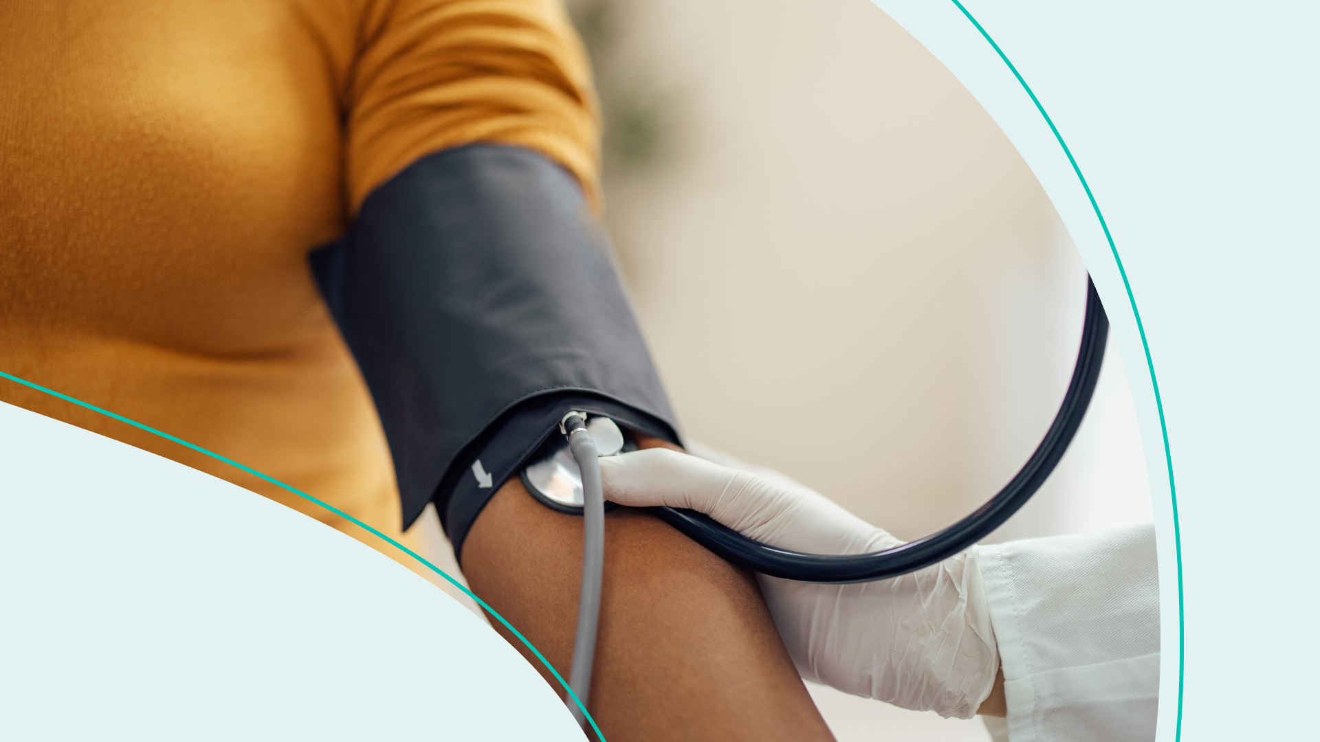 A person in a yellow shirt with a blood pressure cuff around their arm