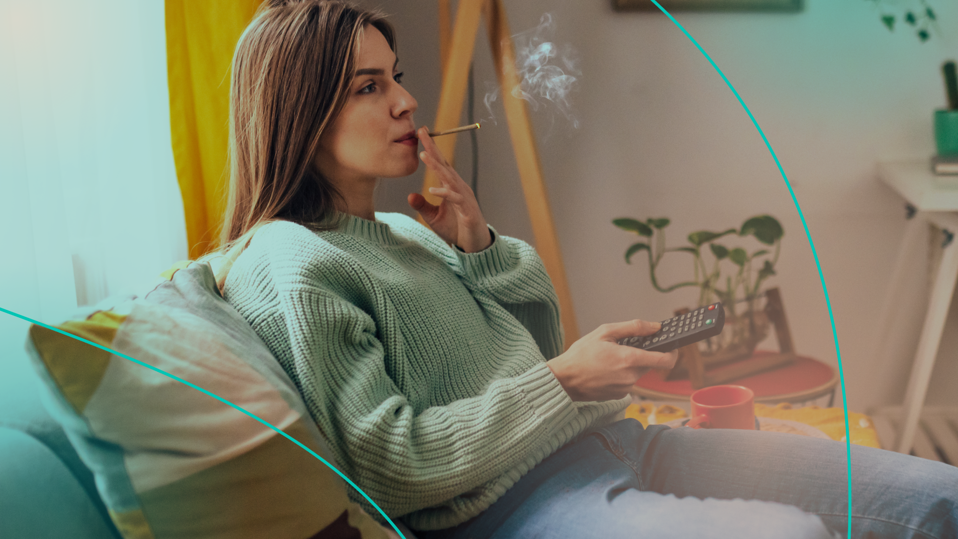 Woman sitting on couch smoking a blunt