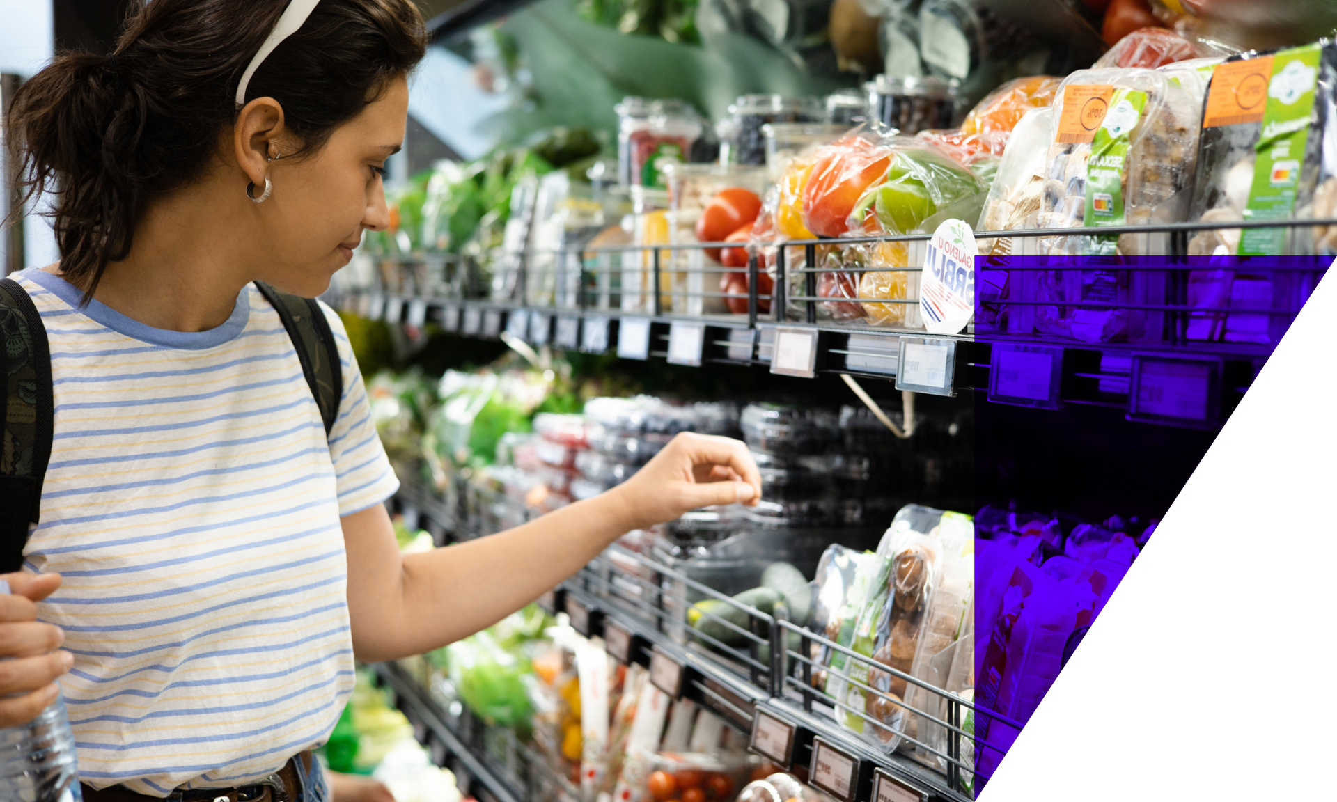 Woman shopping for groceries in the vegetable aisle