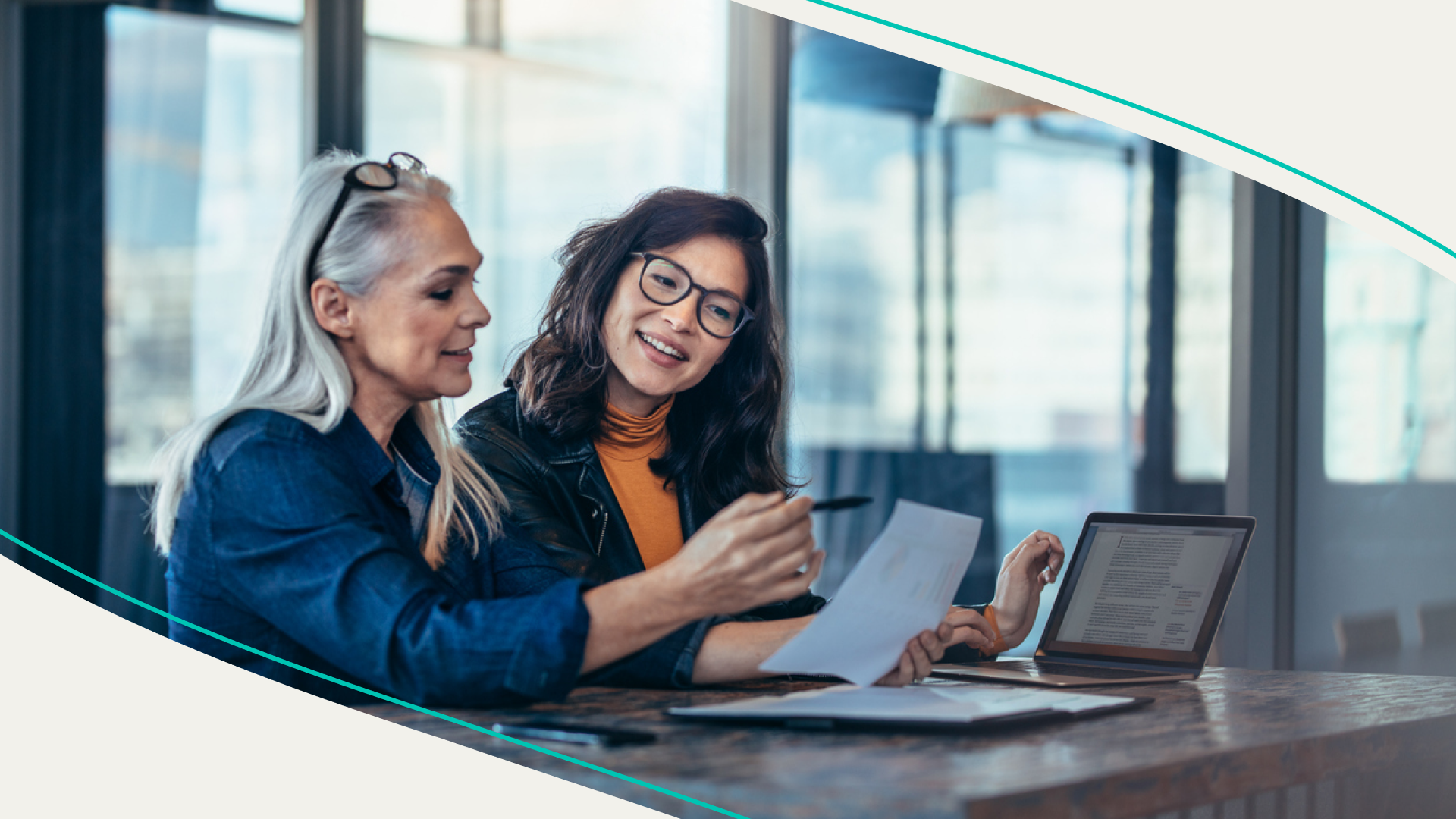 accessibility, two women reviewing documents together