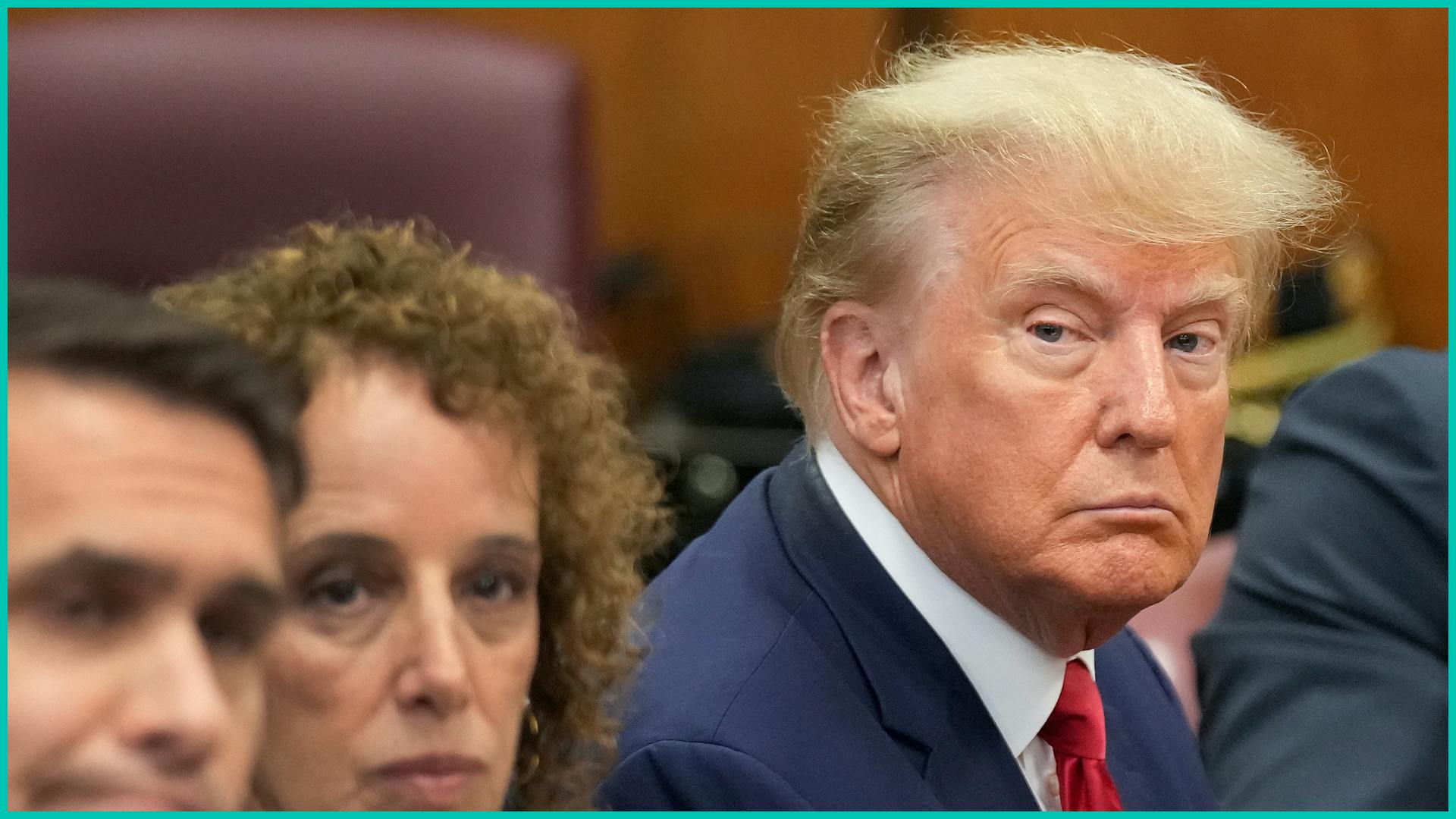 Former U.S. President Donald Trump sits at the defense table with his defense team in a Manhattan court during his arraignment on April 4, 2023, in New York City