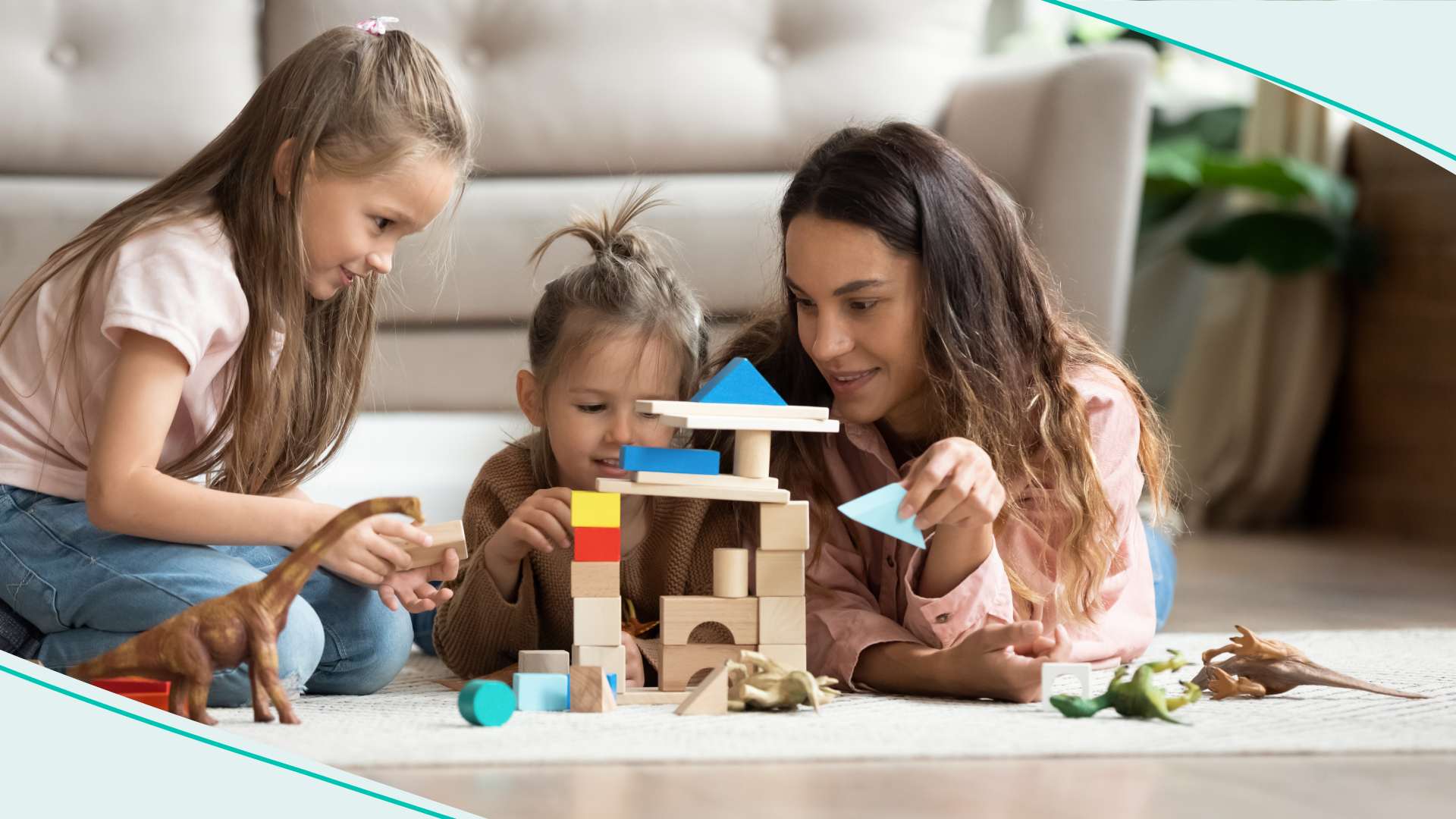 Young female teenager playing with two little girls