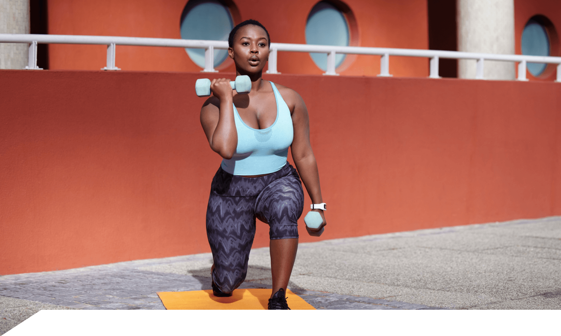 A woman doing a squat on a yoga mat
