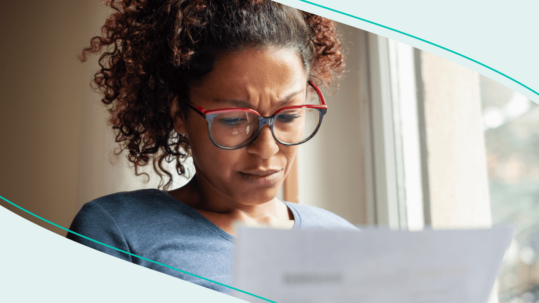 Woman looking at a bill