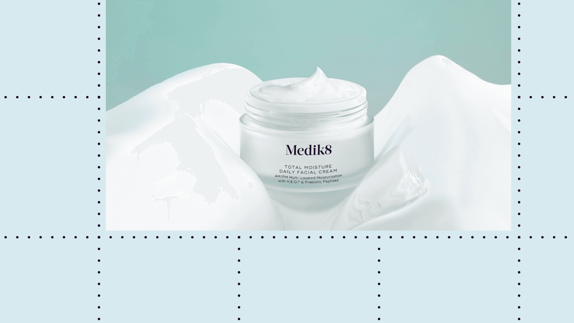 Open Medik8 moisturizer on a teal background