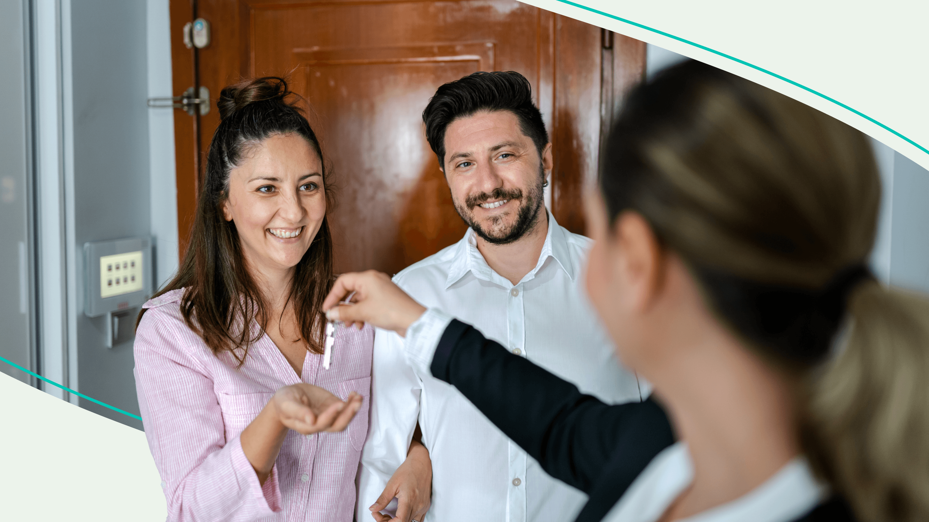 Two renters getting the keys to new apartment from leasing agent