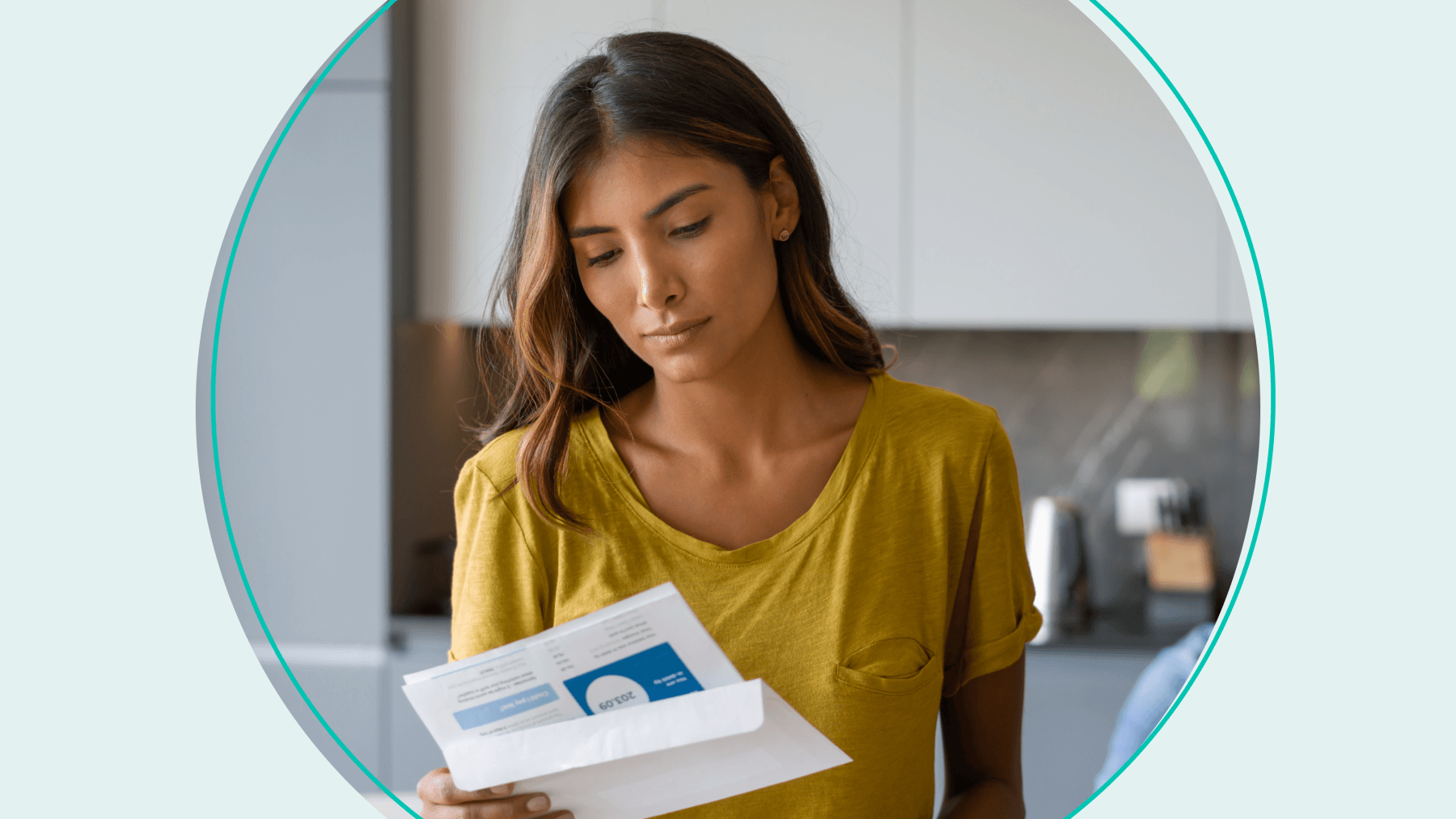 Woman reading credit card bill in kitchen