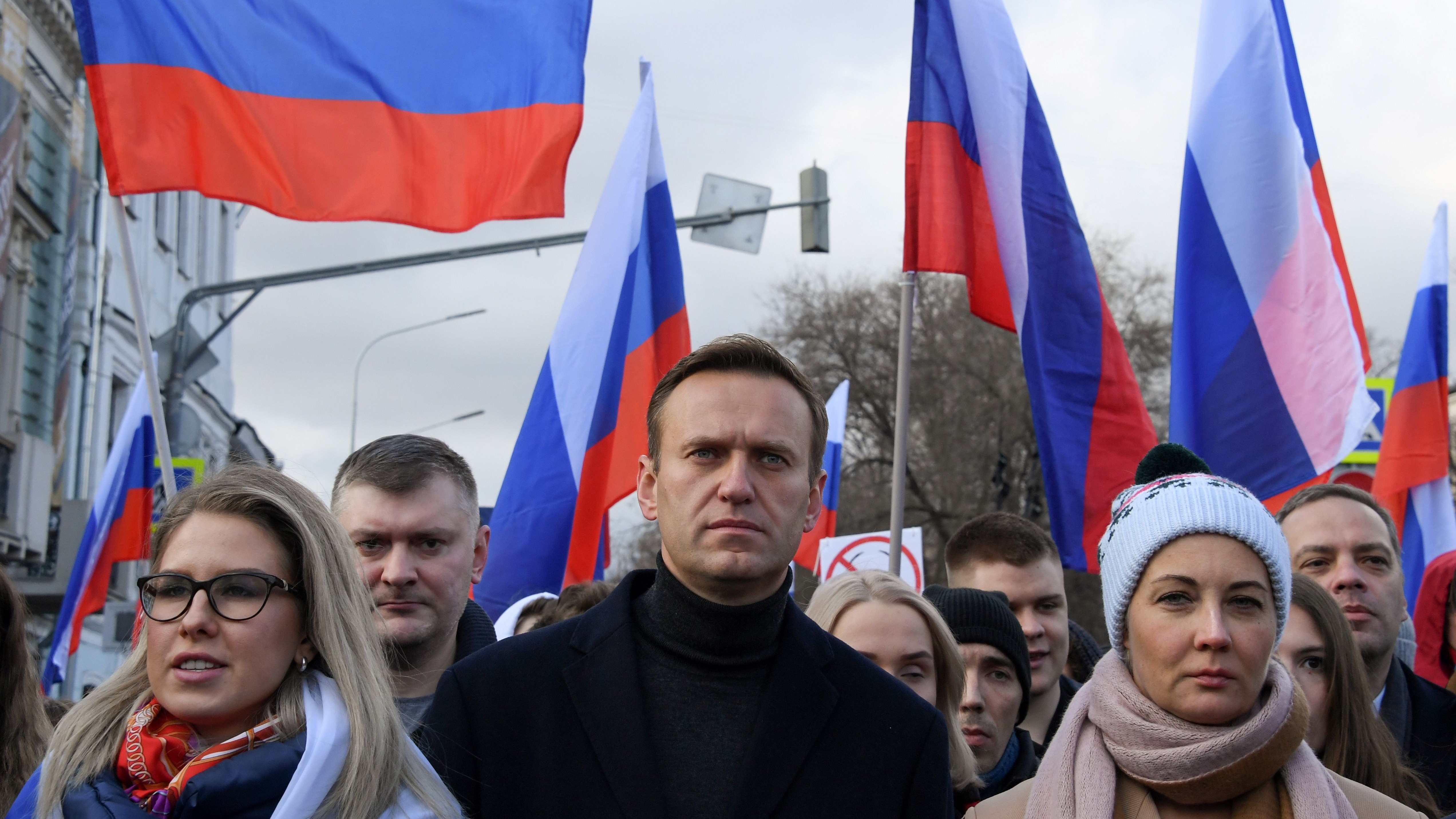 Russian opposition leader Alexei Navalny and other demonstrators take part in a march