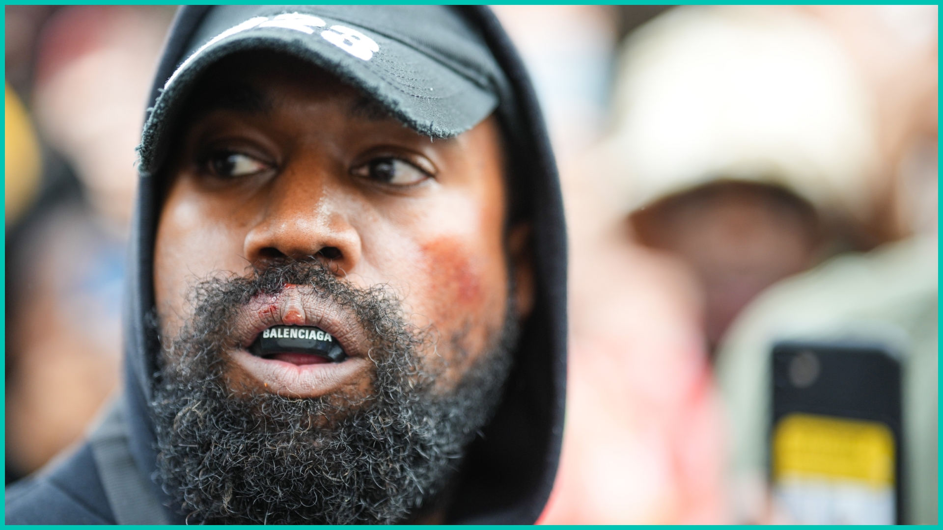 Kanye West aka Ye is seen wearing a Balenciaga boxing mouthguard, outside Givenchy, during Paris Fashion Week