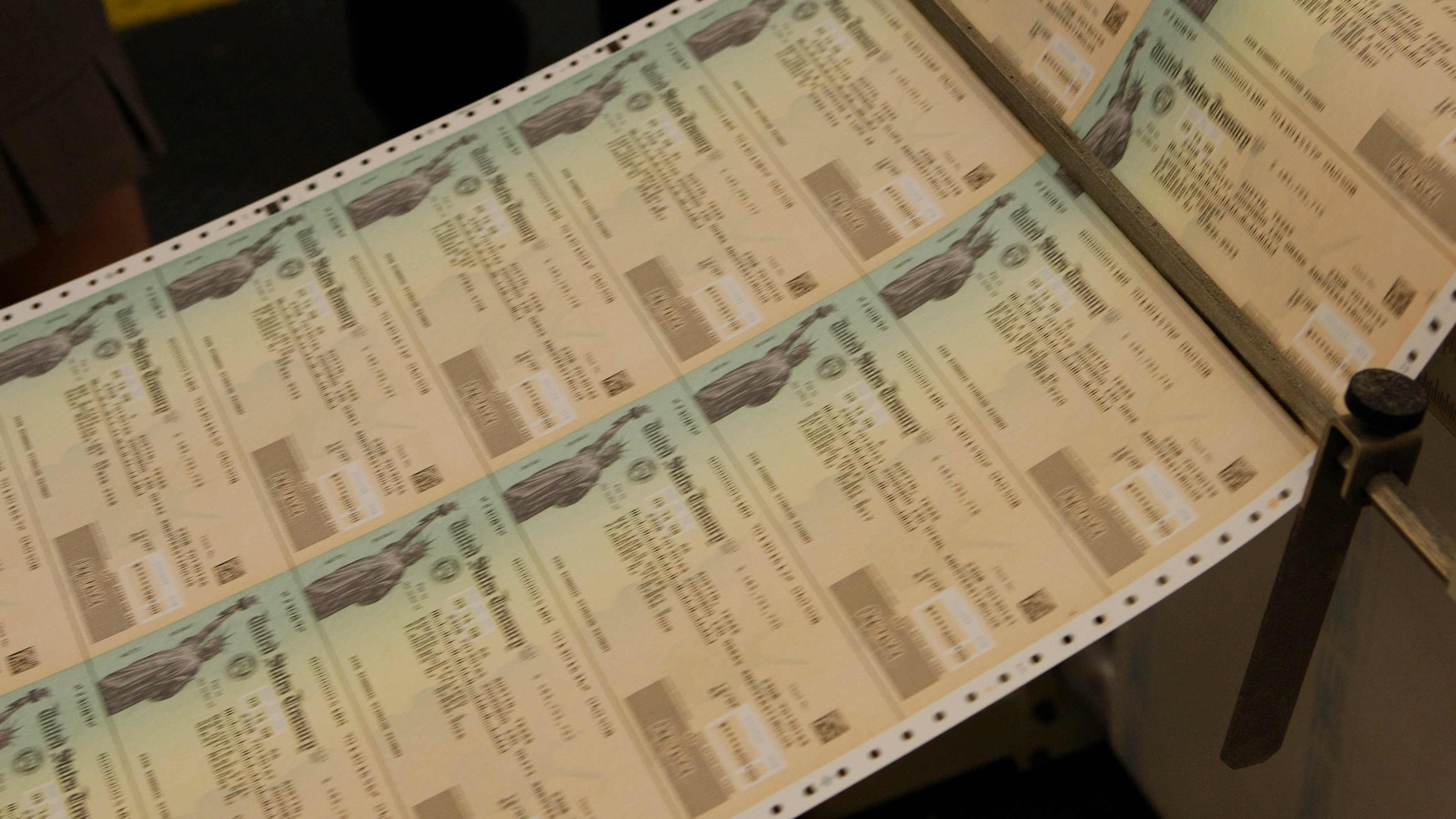 Freshly printed economic stimulus checks roll off the presses