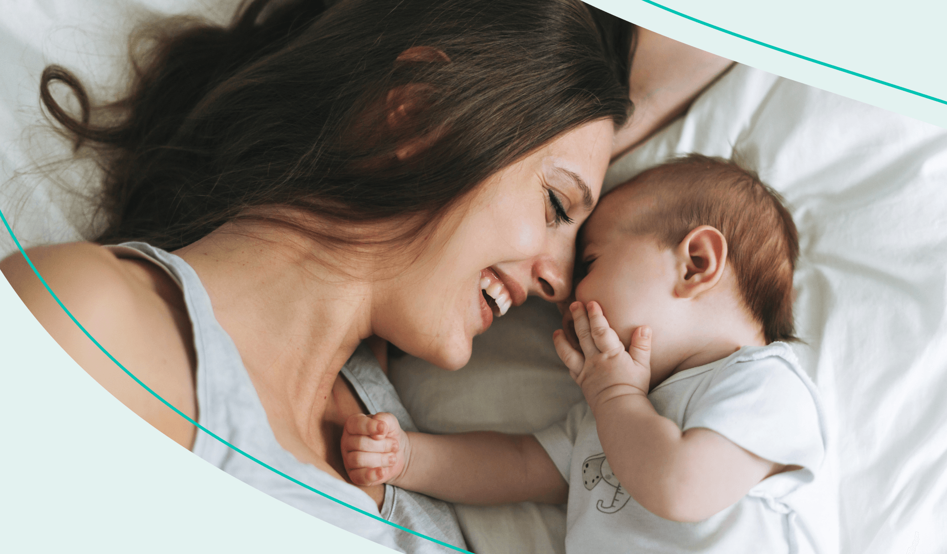 A mother and baby on a bed