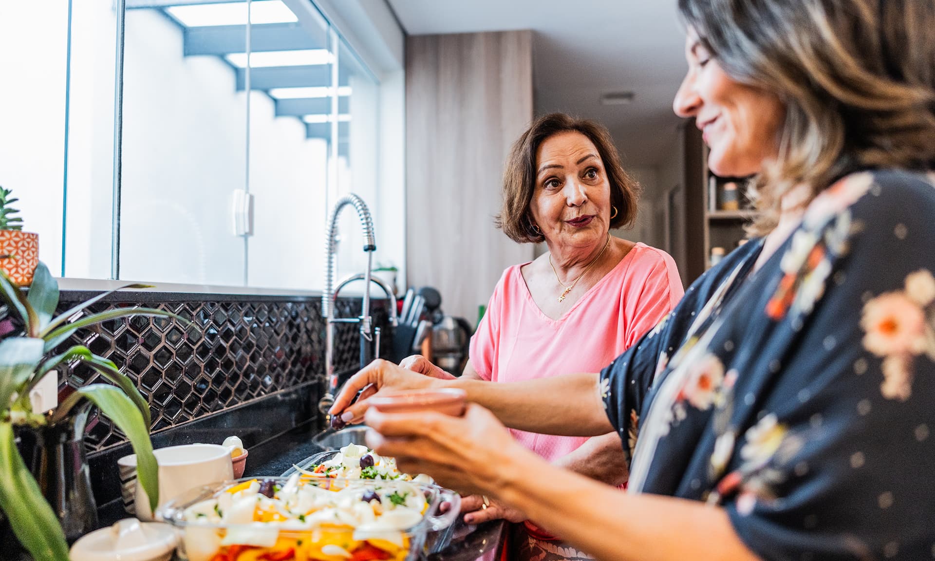 Two women making dinner
