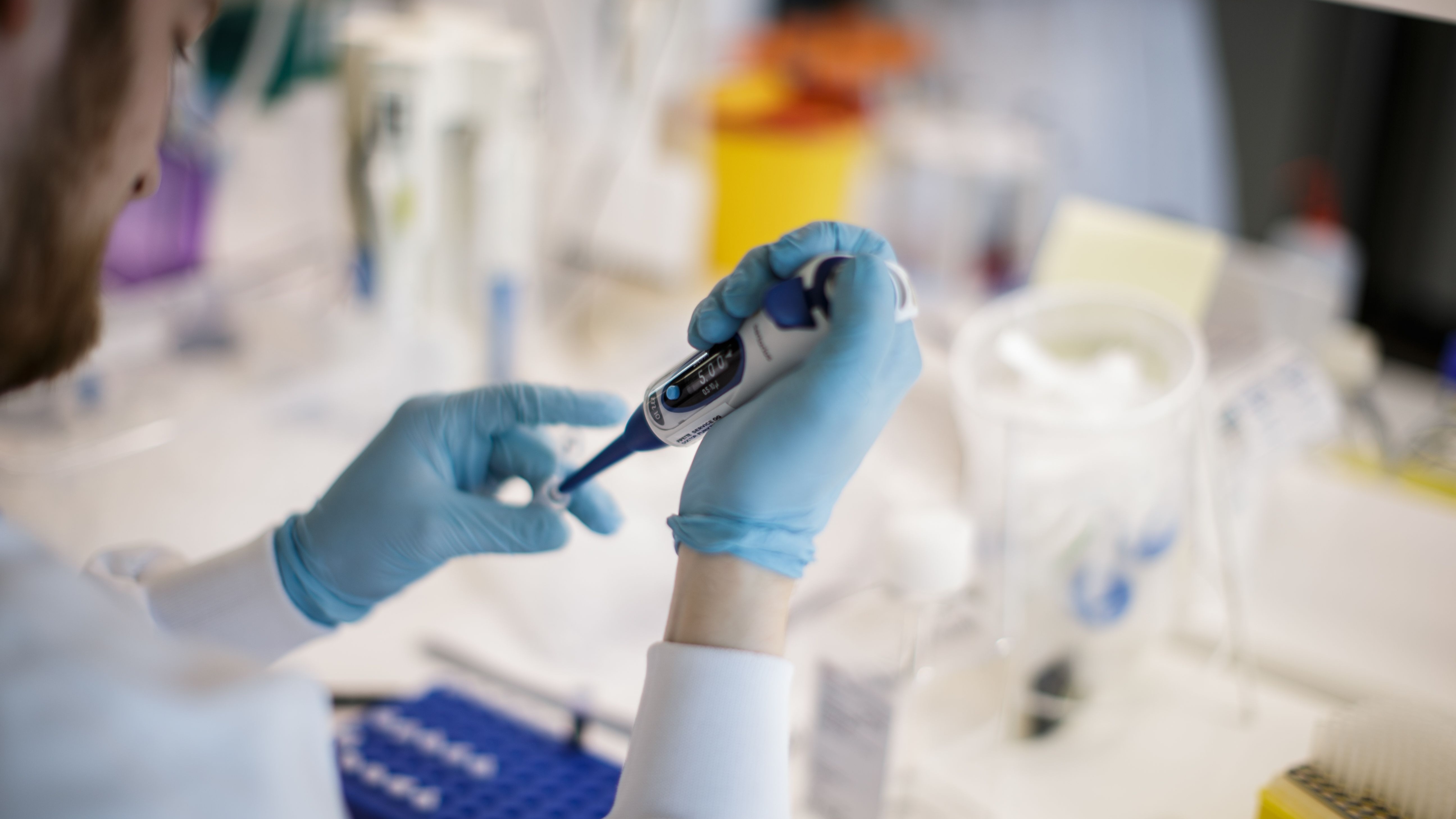 A researcher works on a vaccine against the new coronavirus COVID-19 at the Copenhagen's University research lab in Copenhagen, Denmark, on March 23, 2020.