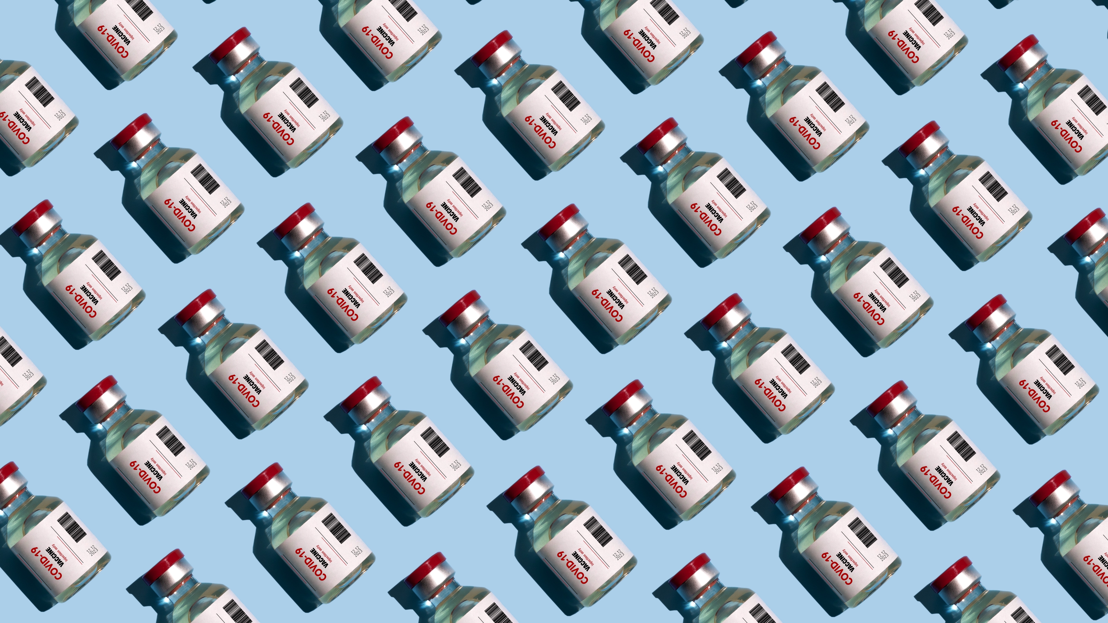 Repeated vials with covid-19 vaccine on the blue background - stock photo