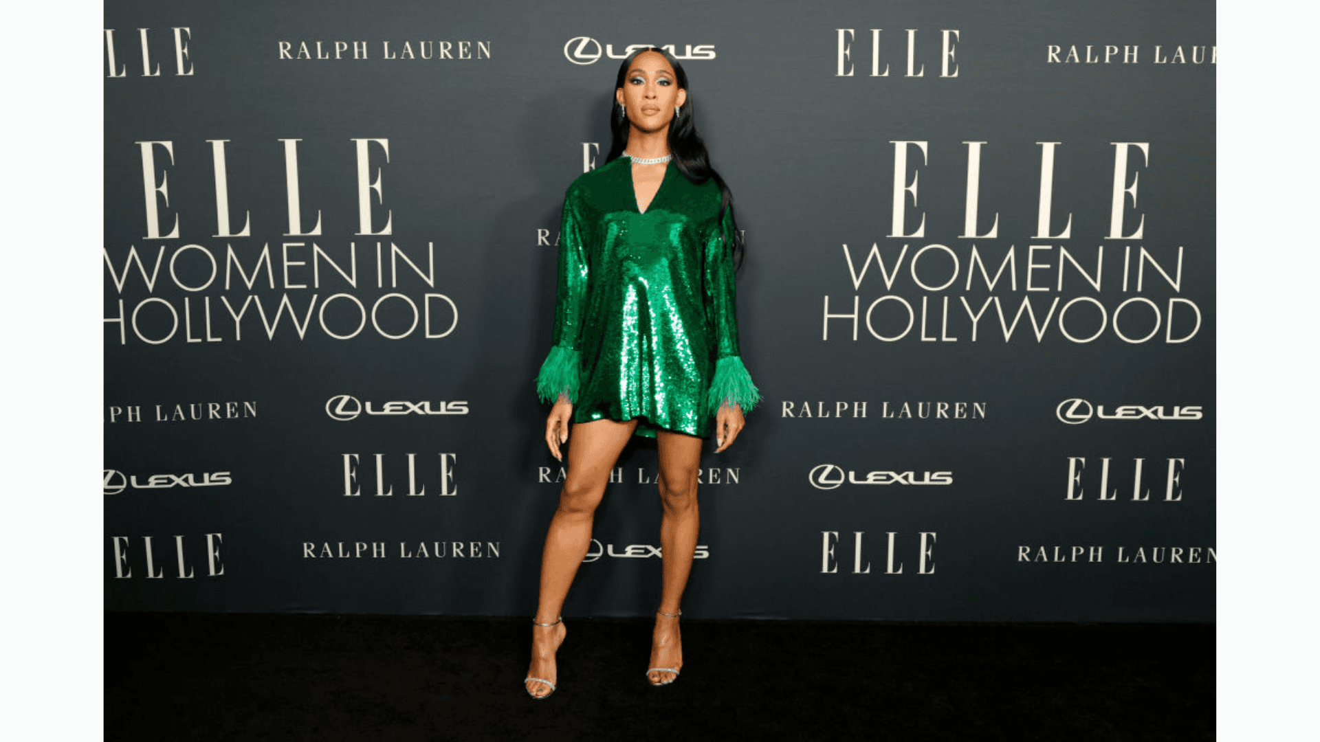 MJ Rodriguez posing for cameras at press event.