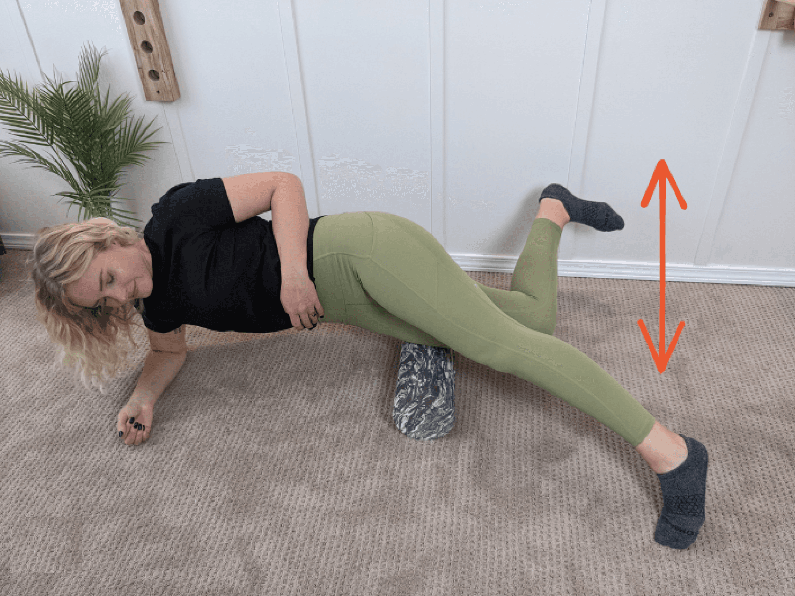 Julia Blackwell foam rolling her IT bands