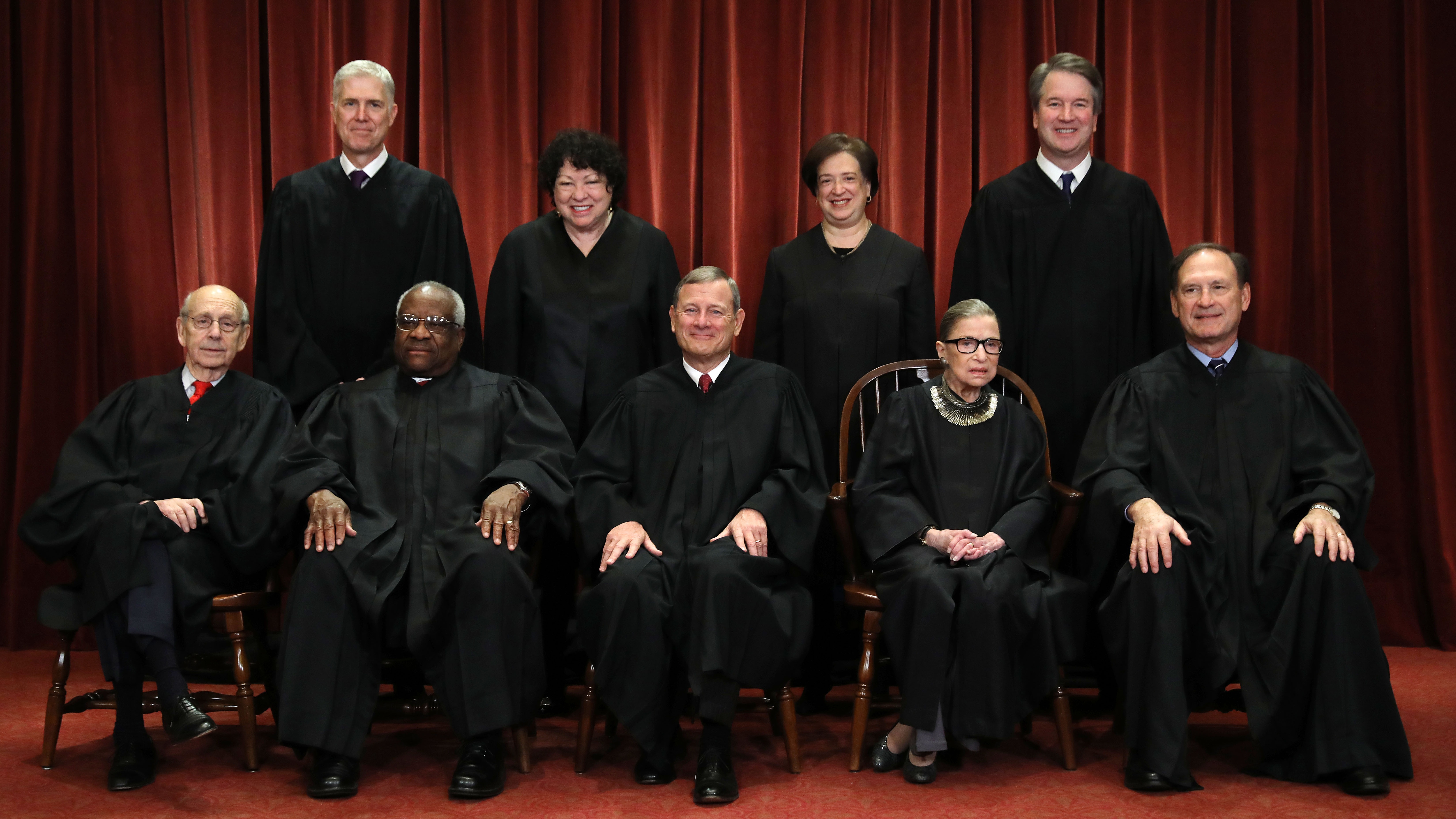 Justices pose for their official portrait at the in the East Conference Room at the Supreme Court building November 30, 2018