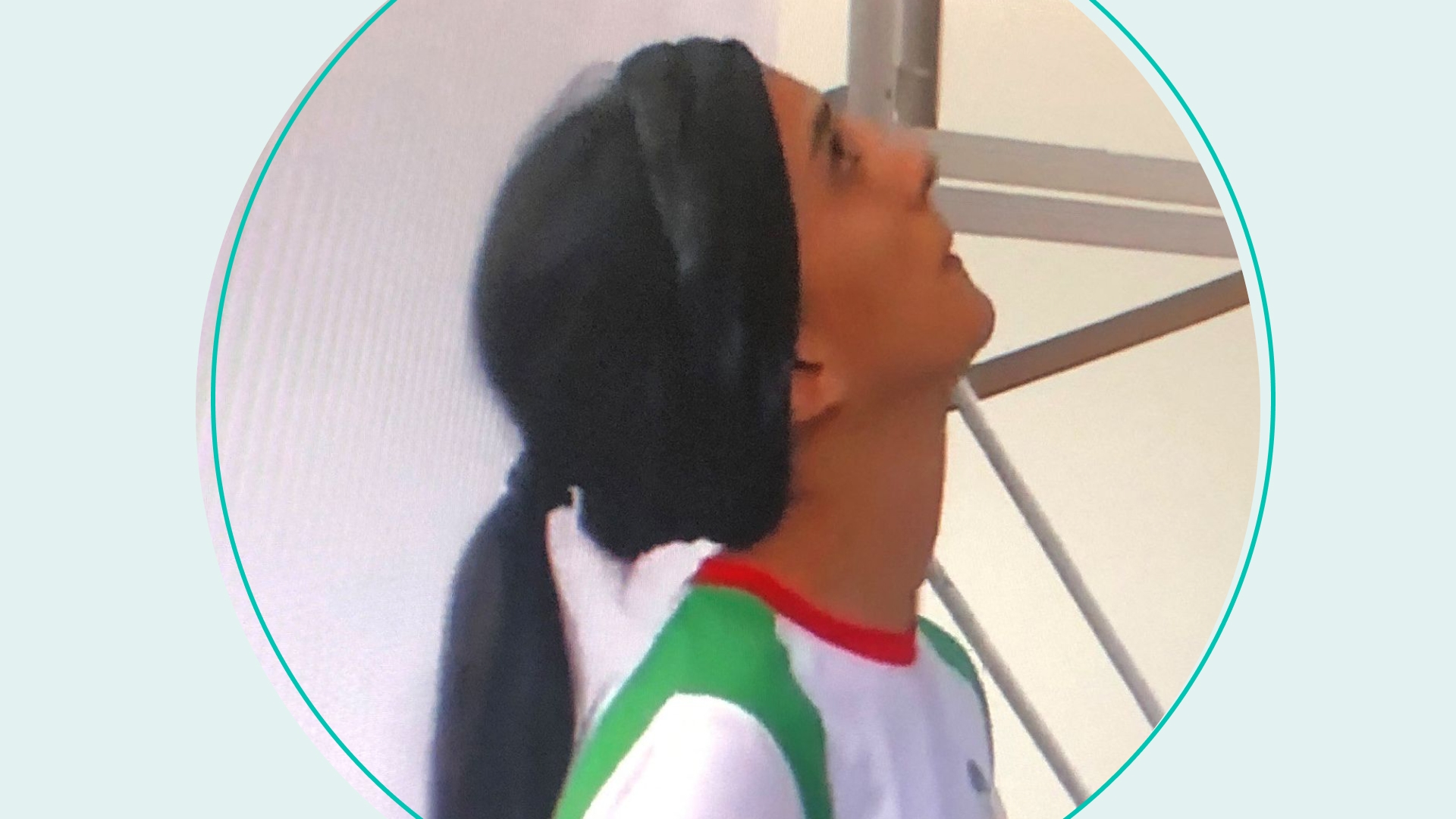 A woman looks at a screen displaying a video of an international climbing competition is Seoul, South Korea, during which Iranian climber Elnaz Rekabi competes without a hijab, in the Cypriot capital Nicosia on October 18, 2022