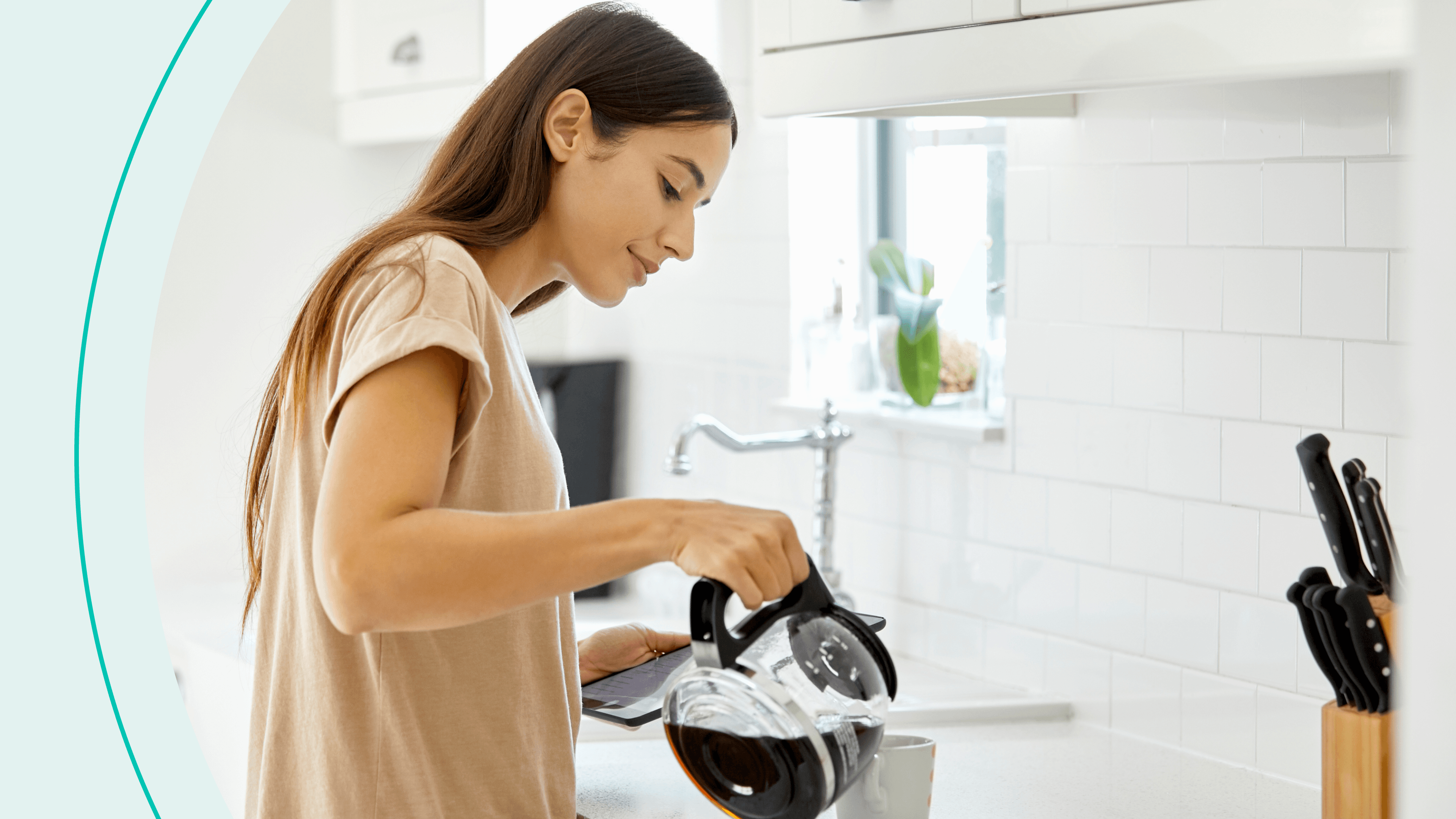 A woman with long brown hair and a brown t shirt pouring a cup of coffee