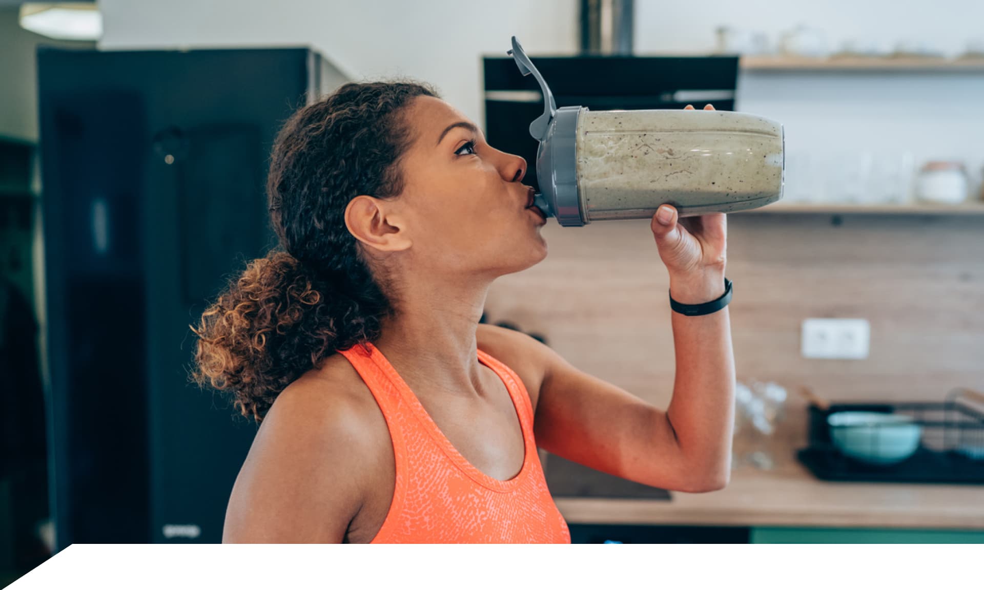 A woman drinking a protein shake