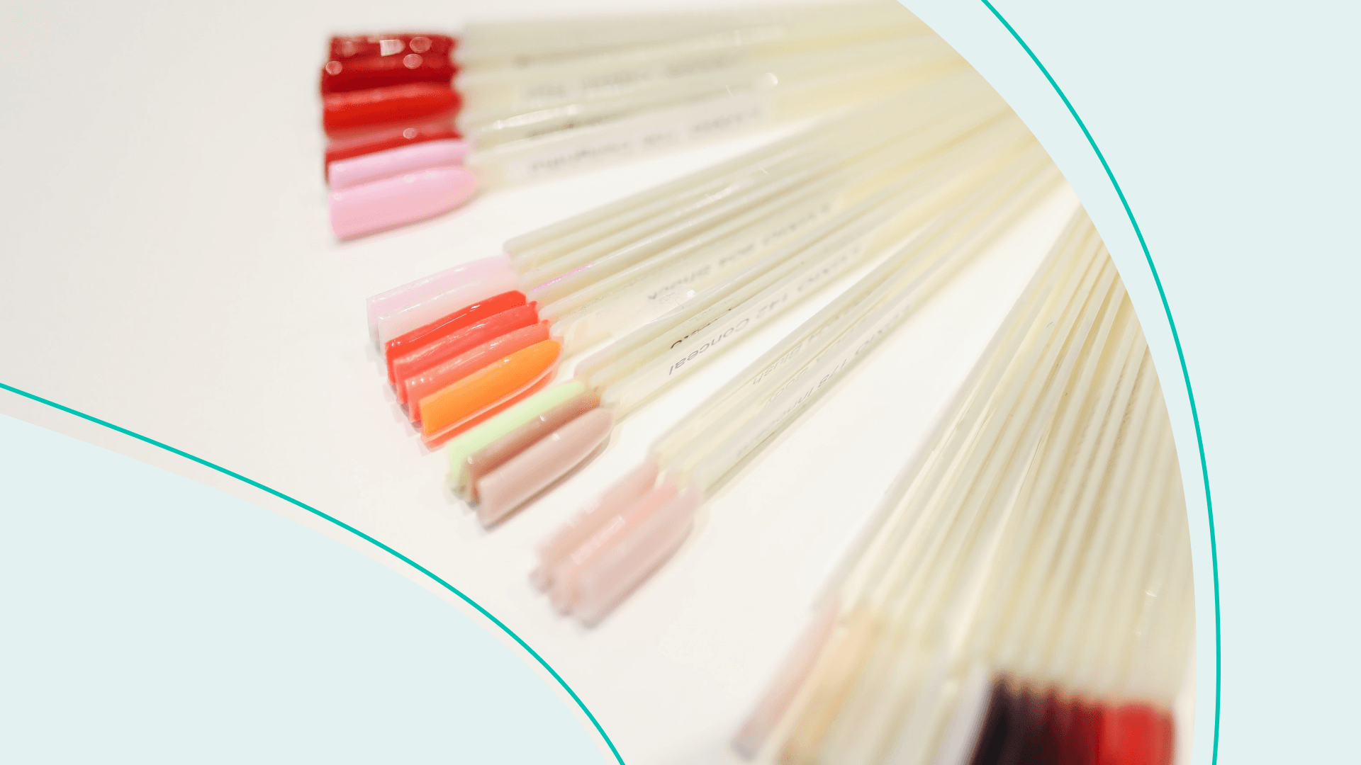 Acrylic nail color samples laid out on a table