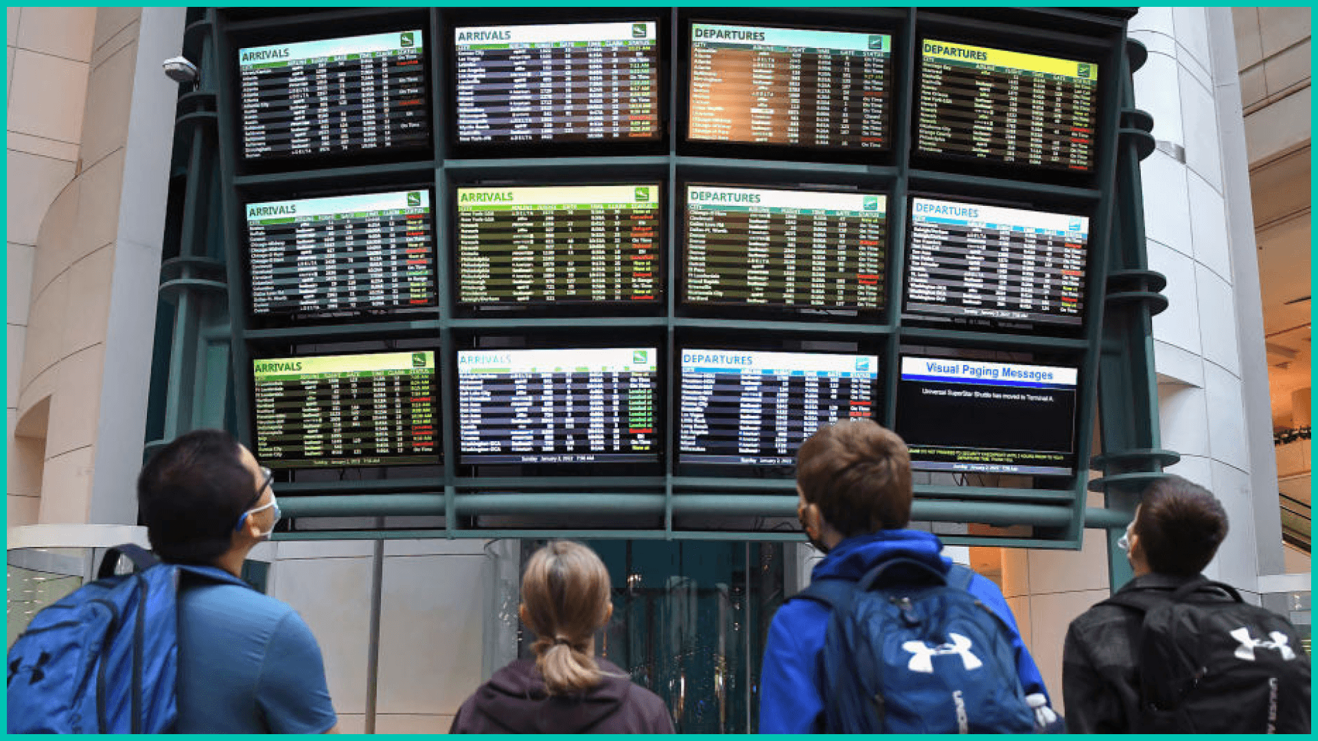 Airline passengers check flight status amid cancellations.